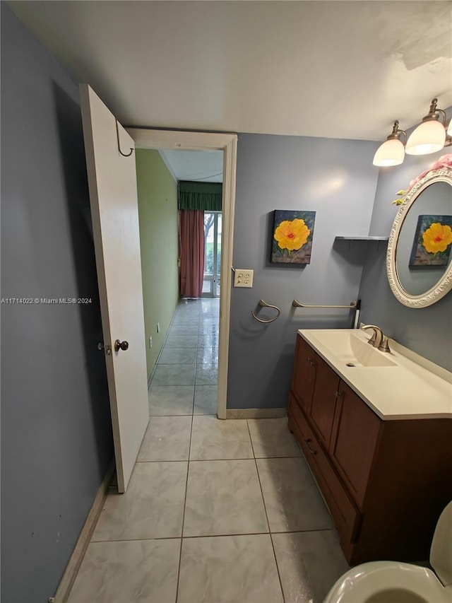 bathroom with tile patterned floors and vanity