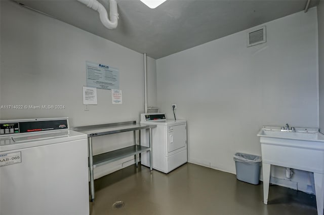 clothes washing area with washer and dryer