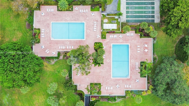 view of subject property featuring a pool