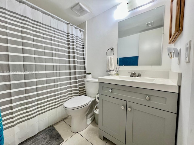 full bath with vanity, tile patterned floors, toilet, and visible vents