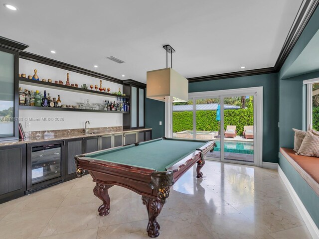 recreation room with wine cooler, wet bar, crown molding, and billiards