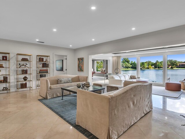 living room featuring a water view and ornamental molding