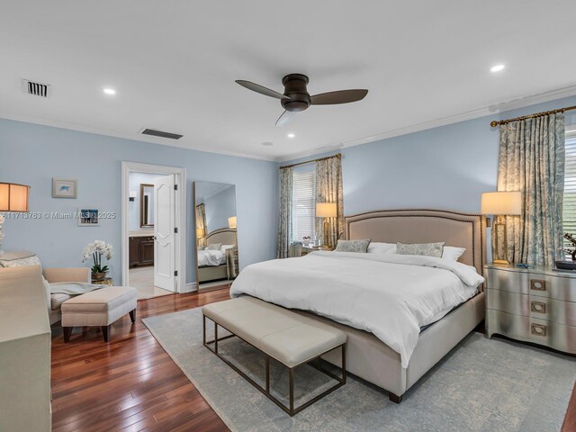 bedroom featuring ceiling fan, ensuite bathroom, ornamental molding, and dark wood-type flooring