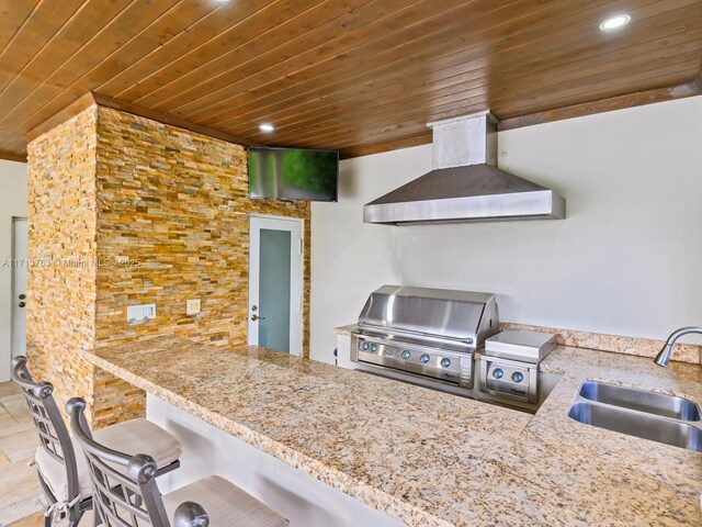 kitchen featuring light stone counters, wooden ceiling, sink, and extractor fan