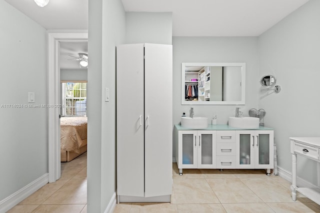 bathroom featuring tile patterned flooring, ceiling fan, and vanity