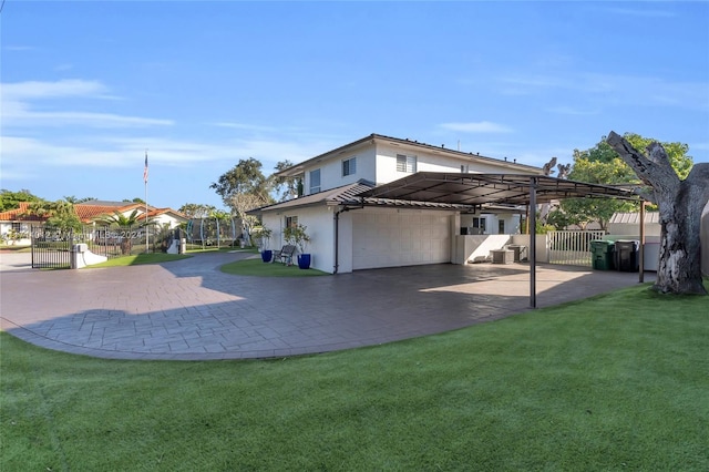 view of side of home featuring a carport, fence, a lawn, and stucco siding