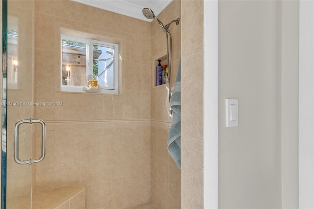 full bath featuring a shower stall and ornamental molding