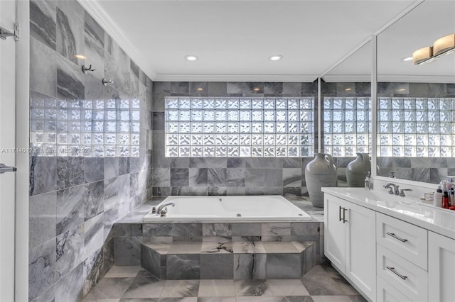 full bathroom with a garden tub, crown molding, vanity, tile walls, and recessed lighting