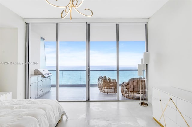 bedroom with floor to ceiling windows, a water view, and multiple windows