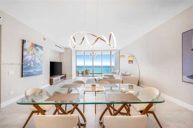 dining area featuring expansive windows and a notable chandelier