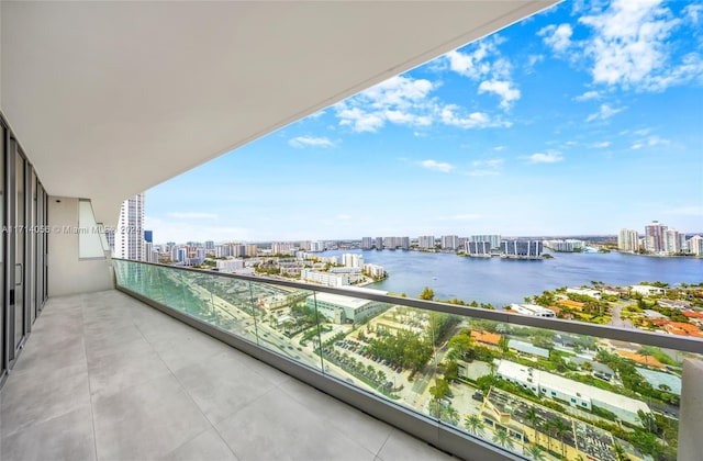 balcony featuring a water view