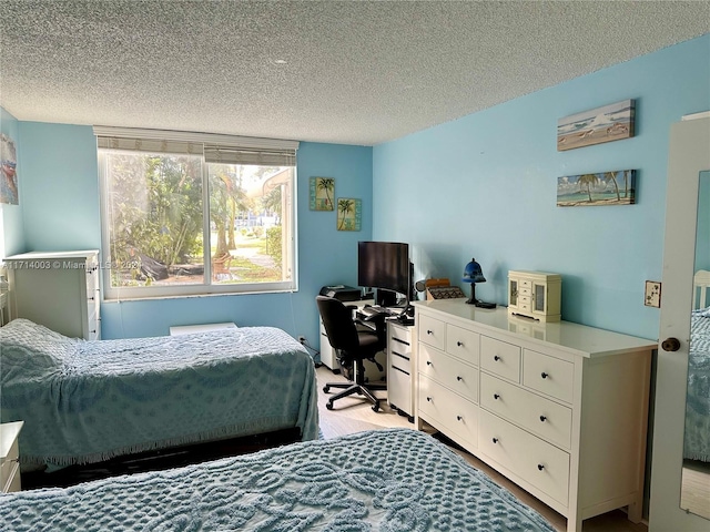 bedroom featuring a textured ceiling