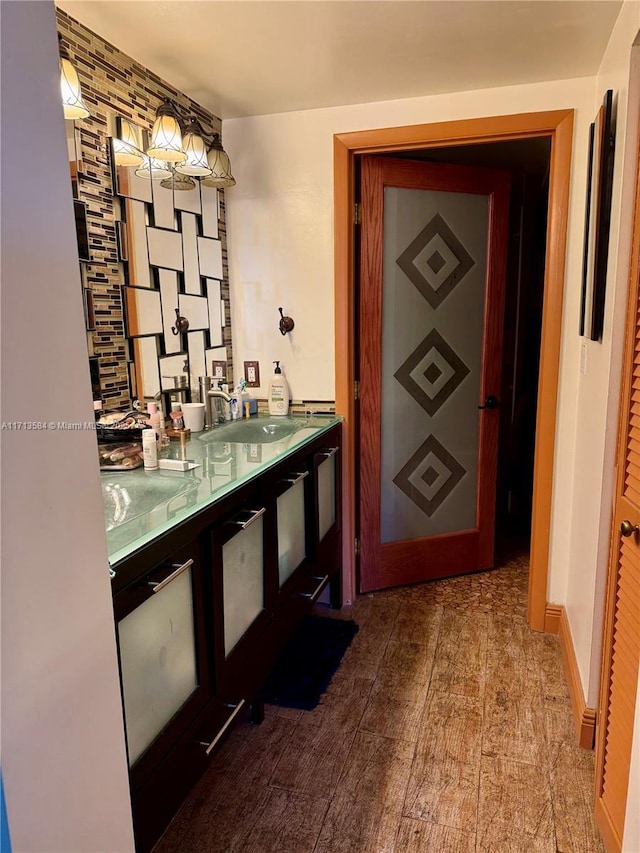 hall with sink and hardwood / wood-style floors