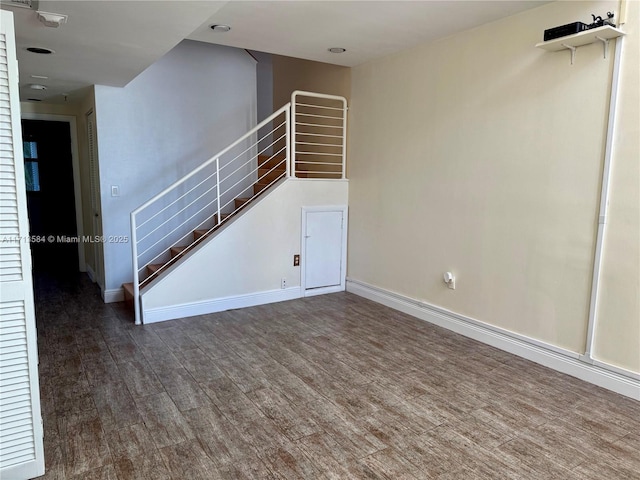 unfurnished living room featuring dark hardwood / wood-style flooring