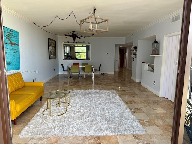 living room featuring ceiling fan with notable chandelier and crown molding