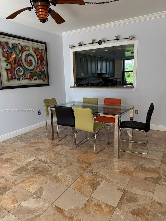 dining space featuring ceiling fan and ornamental molding