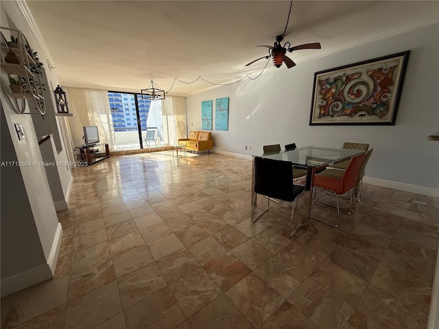 dining room with expansive windows, ceiling fan, and ornamental molding