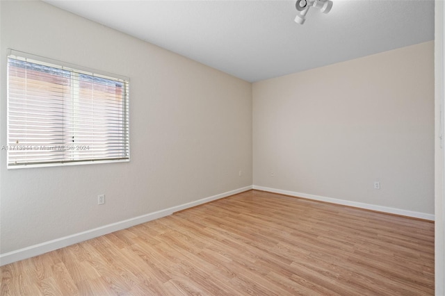 spare room featuring light hardwood / wood-style flooring