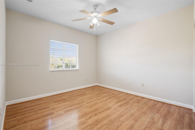 empty room with light wood-type flooring and ceiling fan