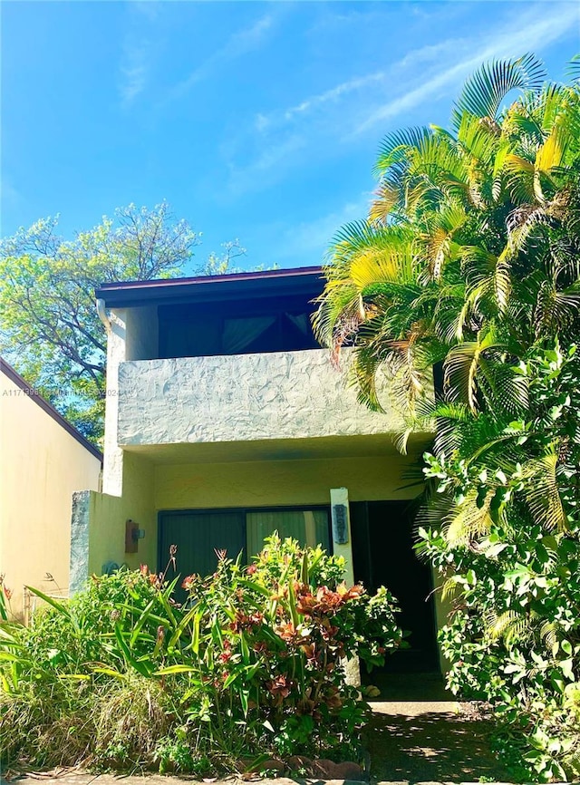 view of home's exterior featuring a balcony