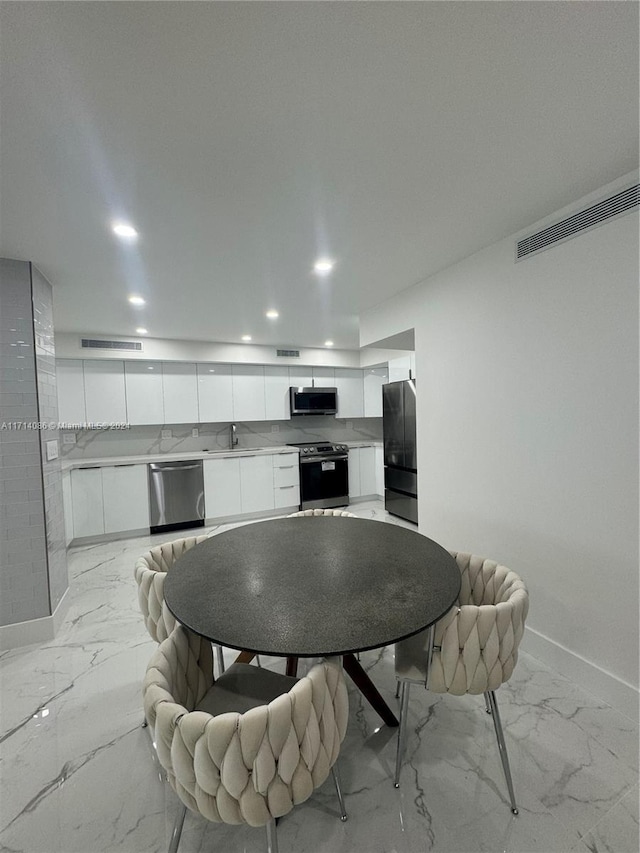 dining space featuring sink