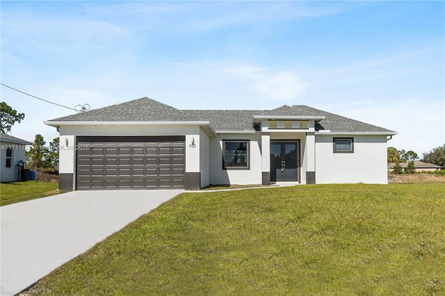 view of front of home with a garage, central AC, and a front yard