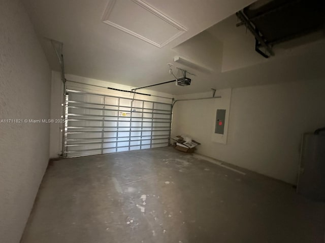 garage featuring electric panel and a garage door opener