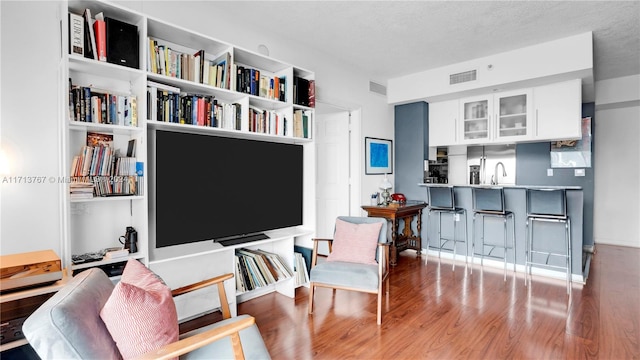 sitting room featuring light hardwood / wood-style flooring and sink