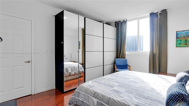 bedroom featuring dark hardwood / wood-style floors