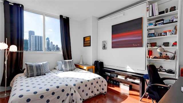 bedroom featuring hardwood / wood-style flooring