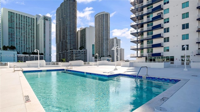 view of swimming pool featuring a patio