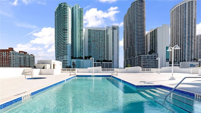 view of swimming pool featuring a patio area