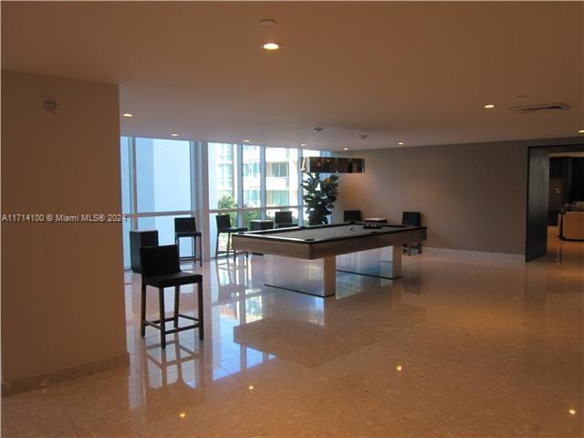 game room featuring expansive windows and pool table