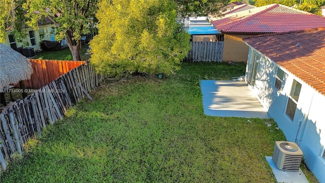 view of yard featuring central AC