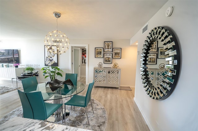 dining space featuring a chandelier and hardwood / wood-style flooring