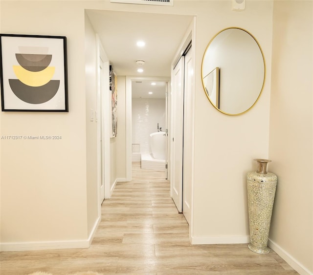 hallway featuring light wood-type flooring