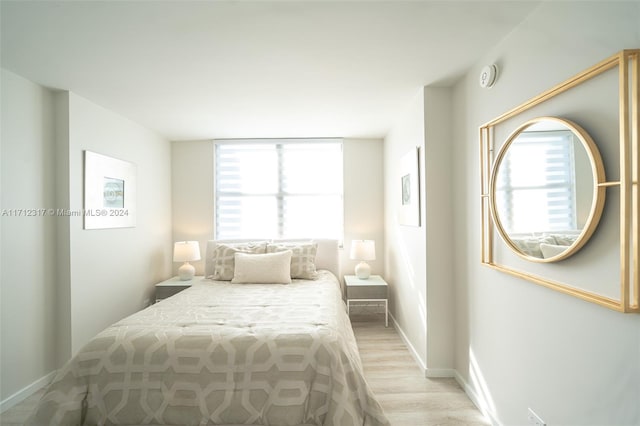 bedroom with light hardwood / wood-style flooring