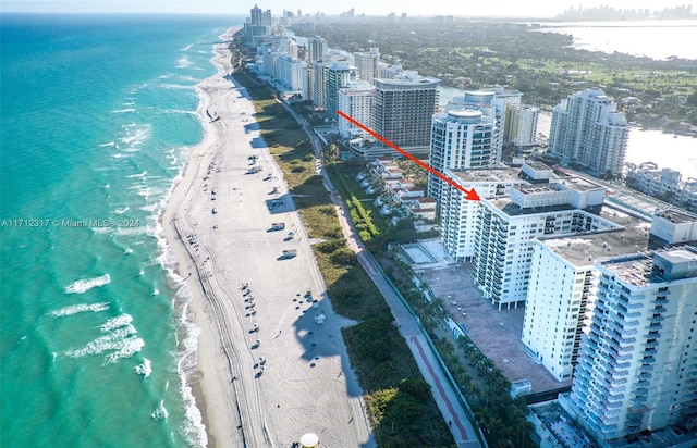 aerial view featuring a water view and a view of the beach