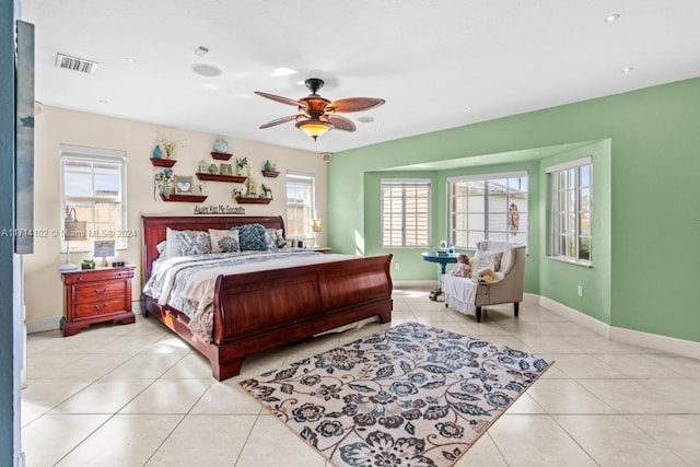 tiled bedroom with ceiling fan