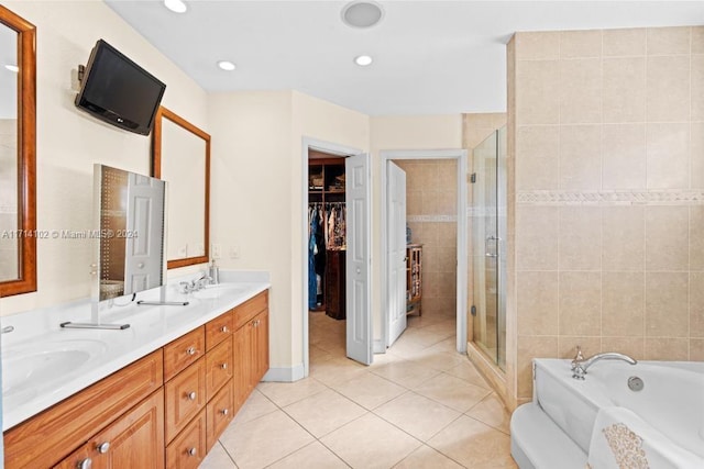 bathroom featuring tile patterned floors, vanity, and separate shower and tub