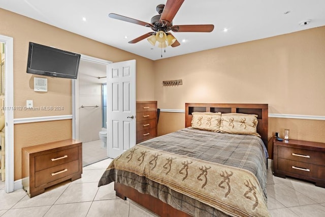 bedroom featuring ceiling fan, light tile patterned flooring, and connected bathroom