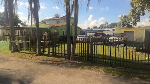 view of gate featuring a lawn