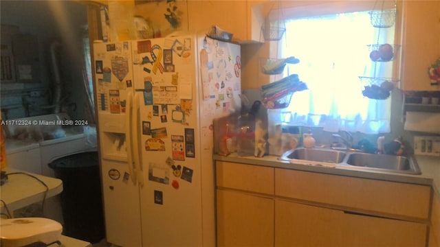 kitchen with sink and white fridge with ice dispenser