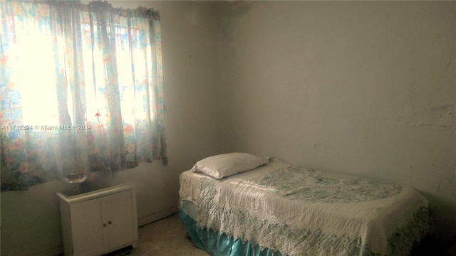 bedroom with light colored carpet