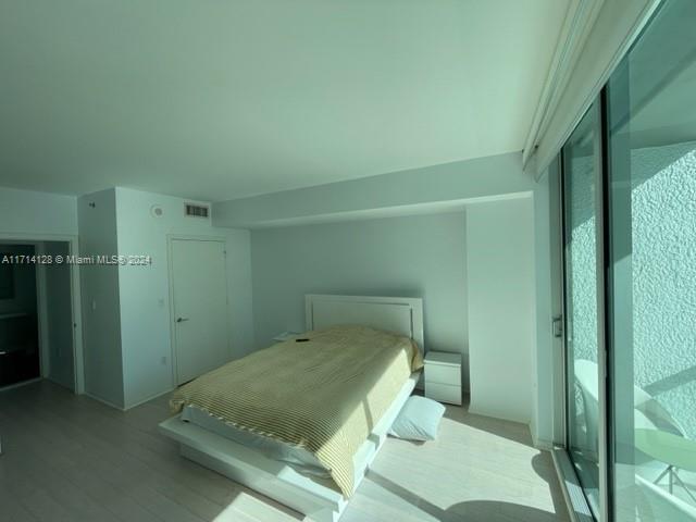 bedroom featuring light wood-type flooring