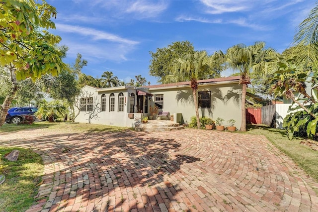 back of property featuring a sunroom