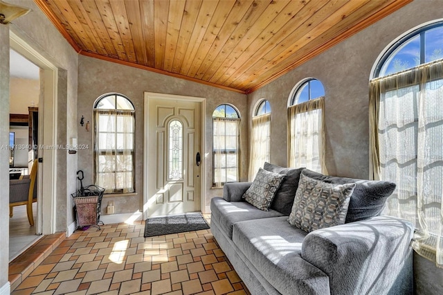 living room with wooden ceiling, crown molding, and high vaulted ceiling