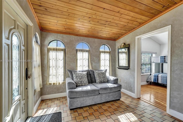 interior space with wooden ceiling, lofted ceiling, and ornamental molding