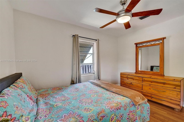 bedroom featuring ceiling fan and wood-type flooring