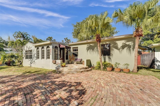 back of property featuring a patio